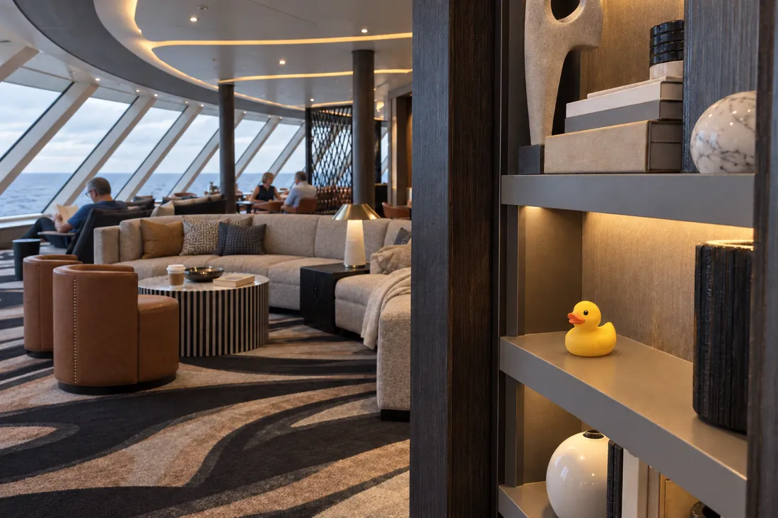 Illustrative scene of a little rubber duck in a cruise ship lounge.